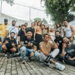 Diverse group of friends having fun and posing for a group photo outdoors in São Paulo.